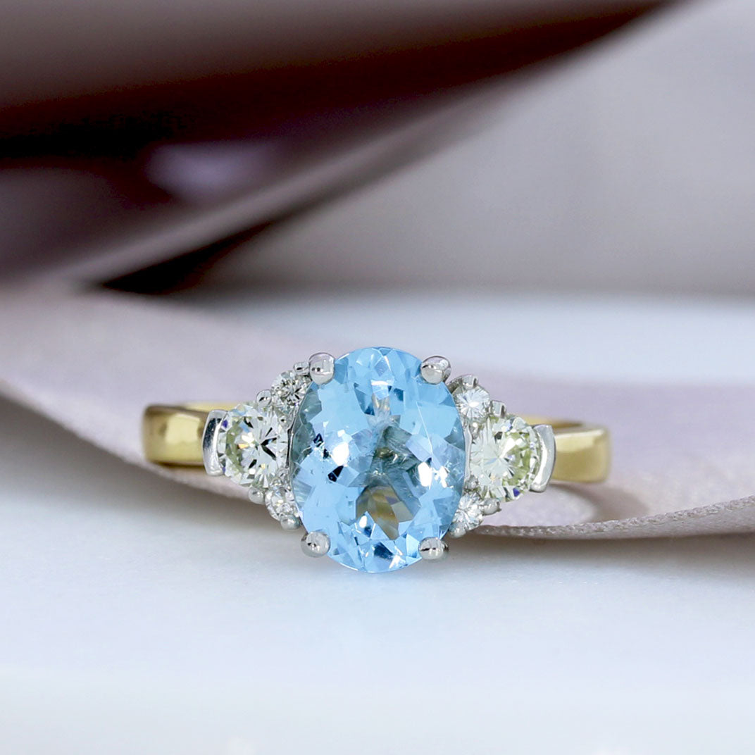 18ct Gold Claw Oval Aquamarine & Diamond Cluster Ring Paul David