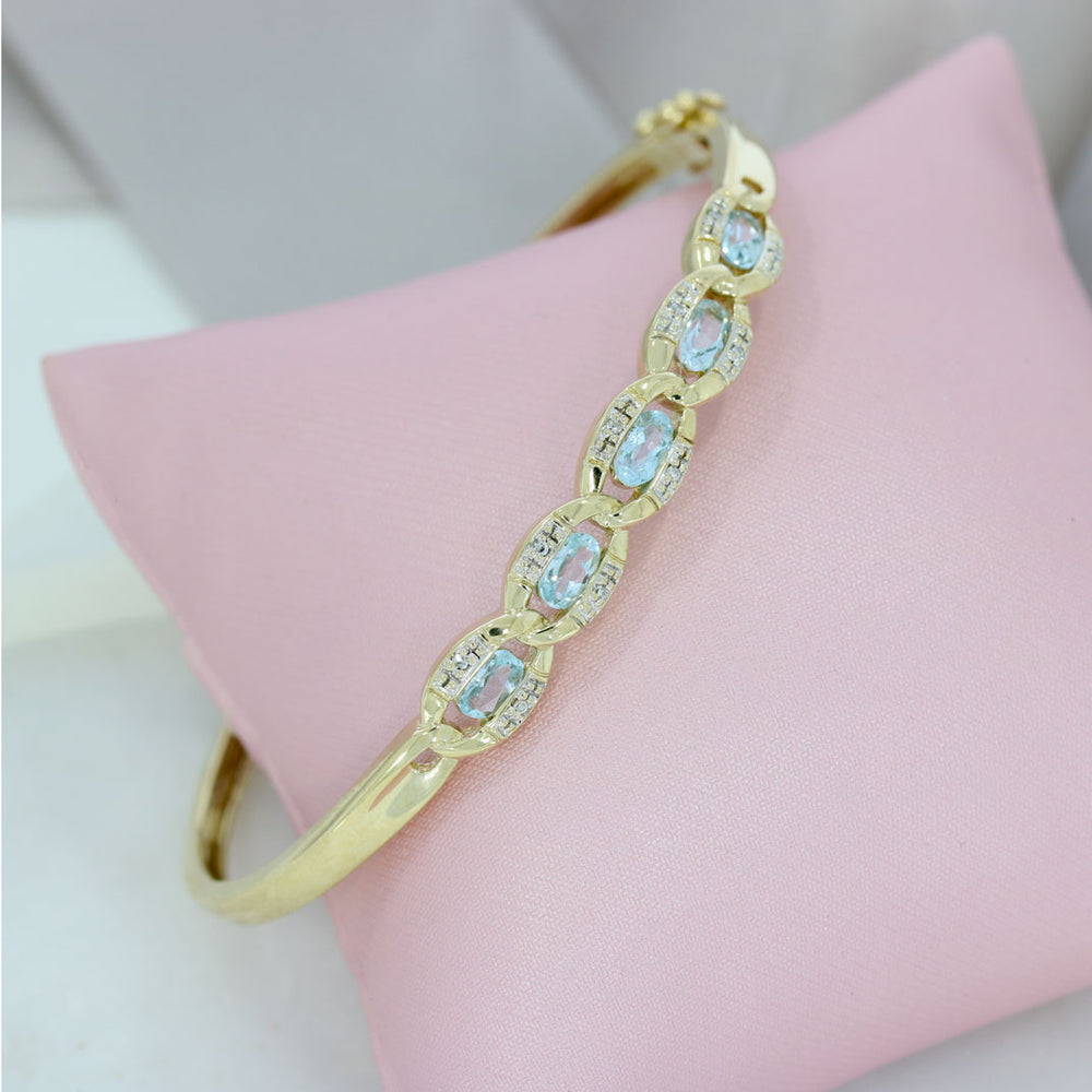 Pre Owned 9ct Yellow Gold Hinged Bangle with Blue Topaz & Diamonds