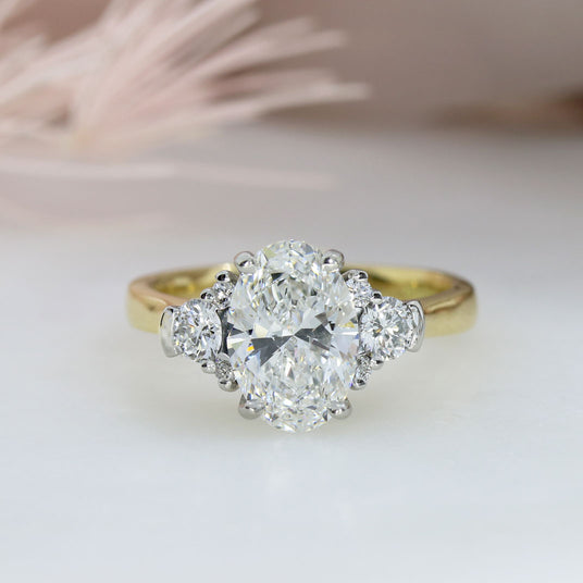 18ct Certified Oval Brilliant Cut Lab Grown Diamond with Stone Set Shoulders Total 2.29ct E VS1