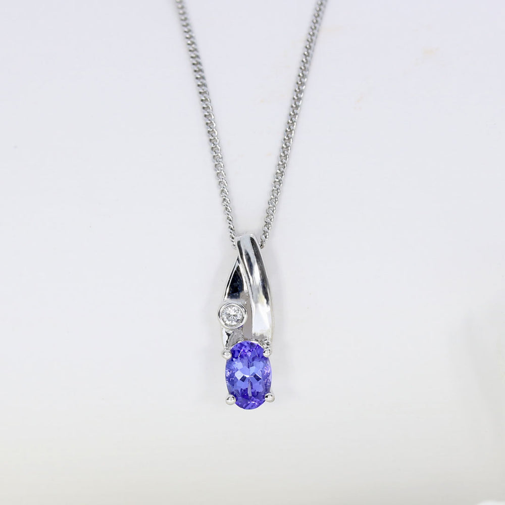 18ct Gold Tanzanite & Diamond Pendent on a 9ct 18inch Chain