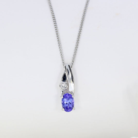 18ct Gold Tanzanite & Diamond Pendent on a 9ct 18inch Chain