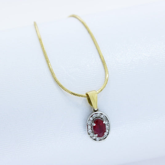 18ct White & Yellow Gold Oval Ruby and Diamond Halo Pendant on an 18ct Chain