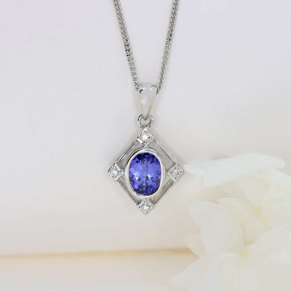 9ct White Gold Tanzanite & Diamond Pendant on a 9ct 16Inch Chain