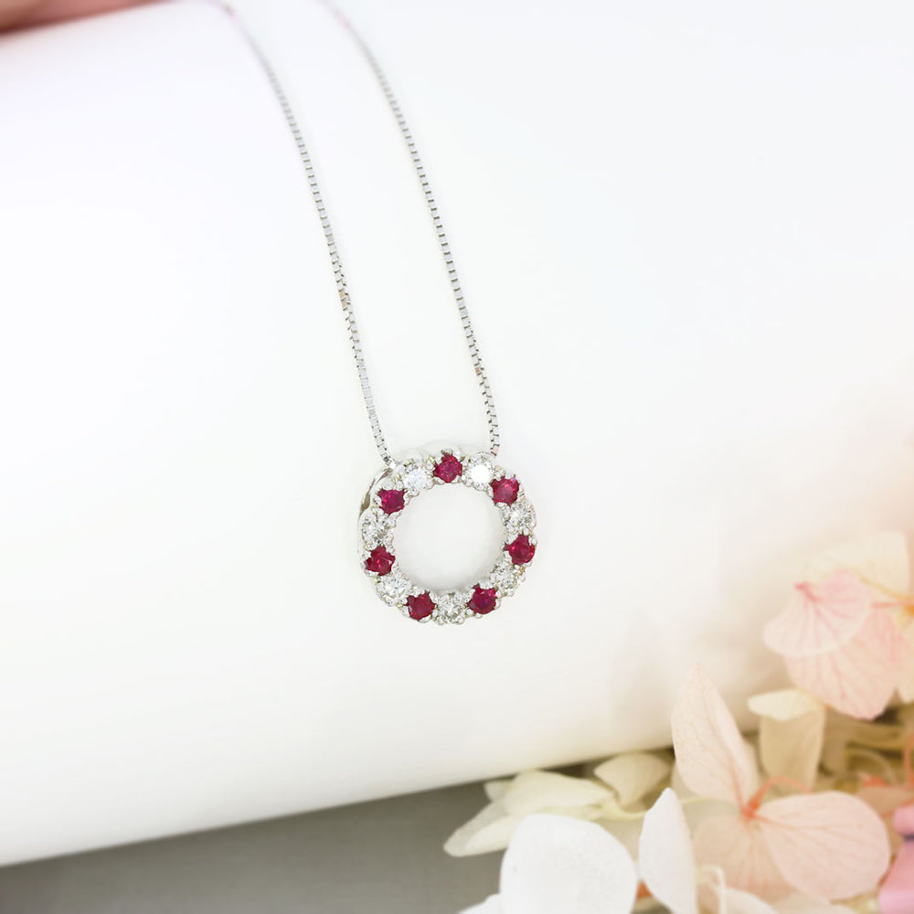 9ct White Gold Circle Pendant with Claw Set Rubies & Diamonds