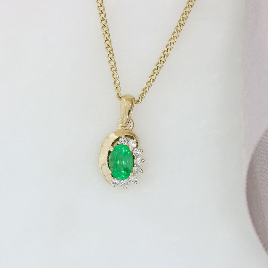 9ct Yellow Gold Oval Emerald Pendant With Claw Set Diamonds on a 9ct 18" Chain