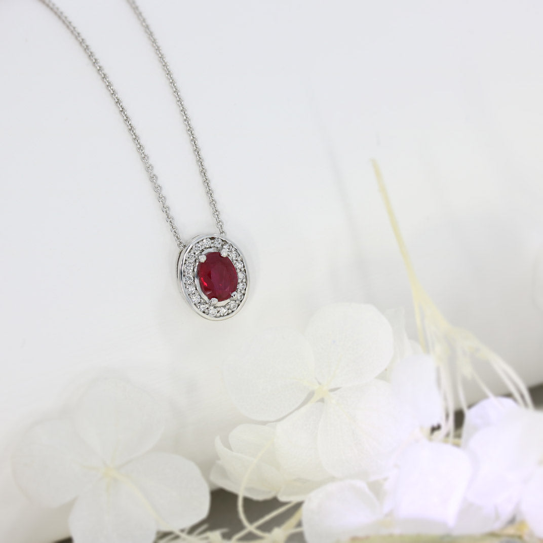 18ct White Gold Oval Ruby and Diamond Halo Pendant on an 18ct 18" Anchor Chain