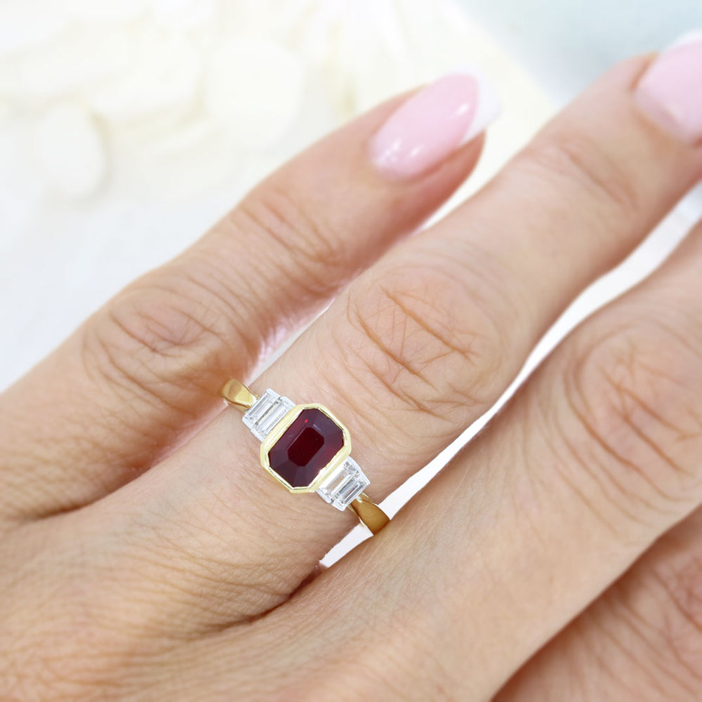 18ct Yellow Gold Rub Over Set Emerald Cut Ruby and 4 Baguette Diamond Ring