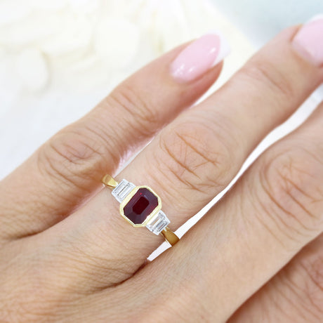18ct Yellow Gold Rub Over Set Emerald Cut Ruby and 4 Baguette Diamond Ring