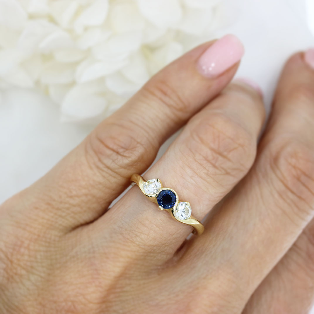 18ct Yellow gold sapphire and diamond three stone ring