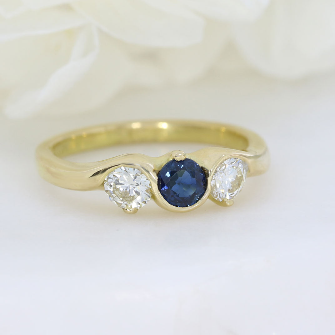 18ct Yellow gold sapphire and diamond three stone ring