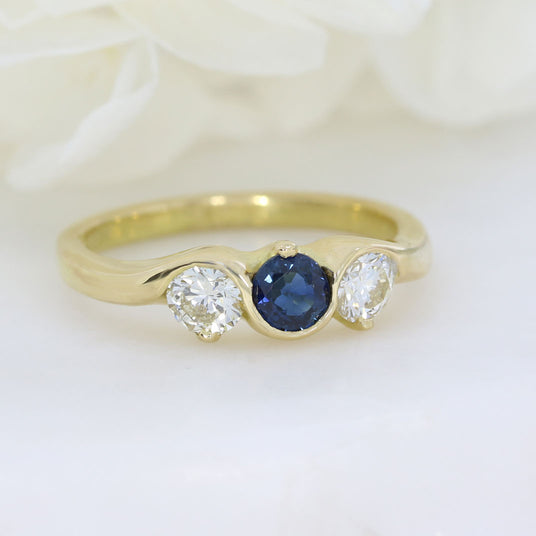 18ct Yellow gold sapphire and diamond three stone ring
