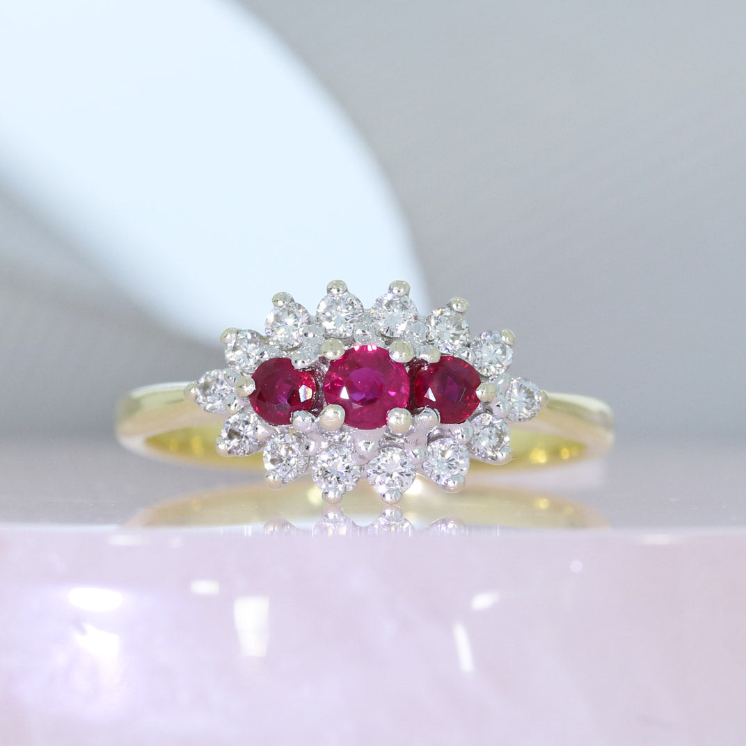 18ct Gold Ruby & Diamond Cluster Ring Approx Diamond Weight: 0.25ct