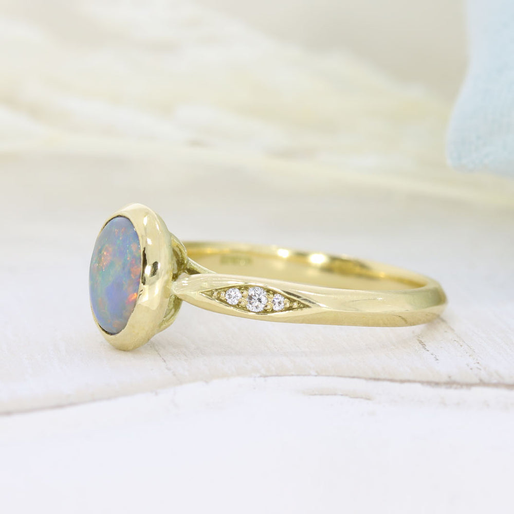 18ct Yellow Gold Oval Rubover Set Opal Dress Ring with Pave Set Diamond Shoulders