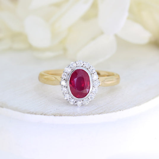 18ct Rose gold rub over set oval ruby and claw set diamond cluster ring