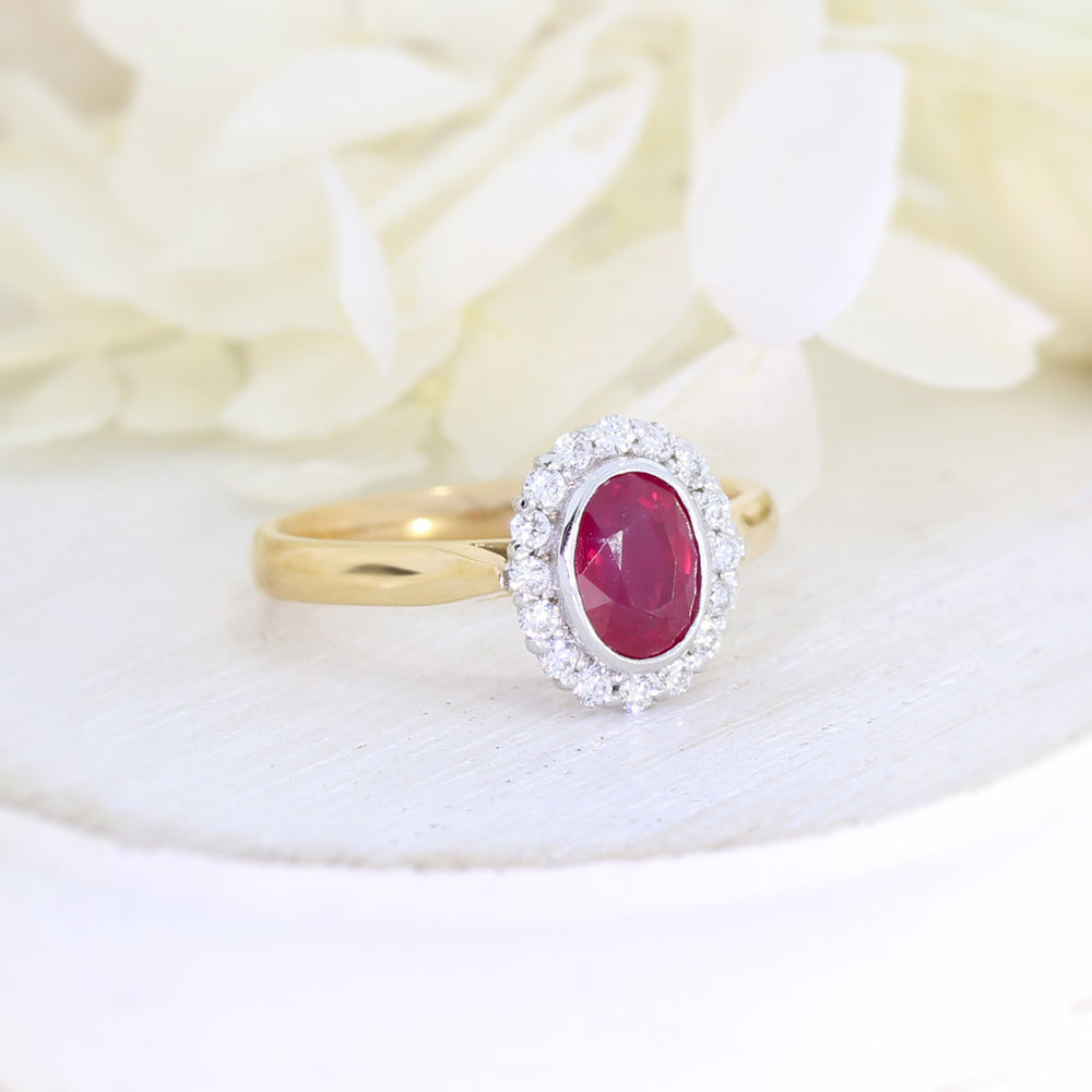 18ct Rose gold rub over set oval ruby and claw set diamond cluster ring