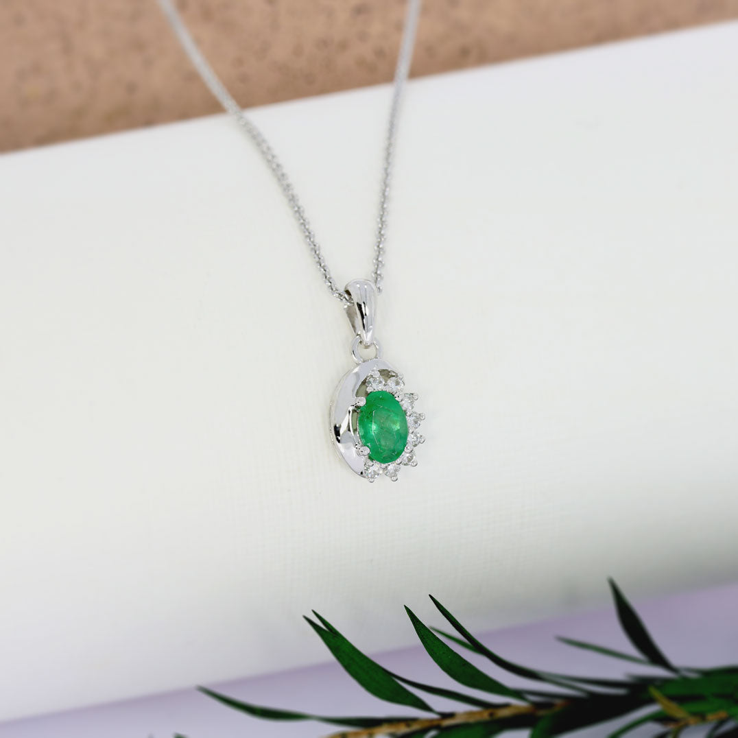 9ct White Gold Oval Emerald Pendant With Claw Set Diamonds To One Side