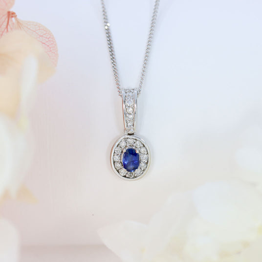 18ct White Gold Sapphire and Diamond Oval Cluster Pendant On a 18ct 18" Chain