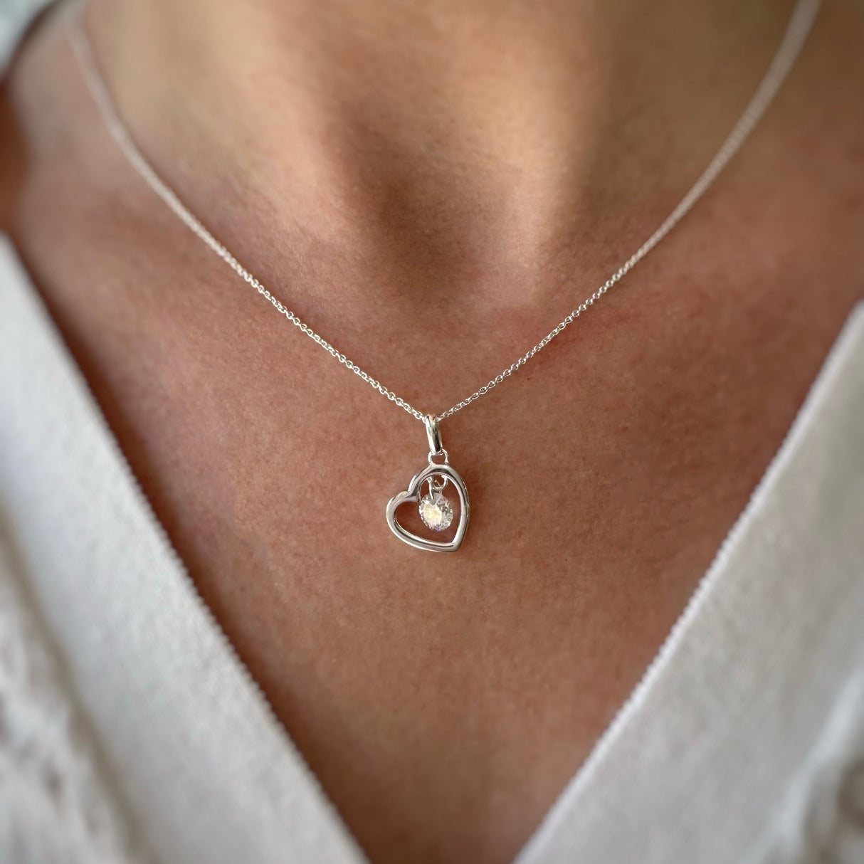 Silver Open Heart Pendant With Suspended CZ