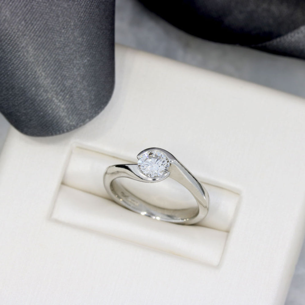 Pre Owned Platinum Certified Diamond Solitaire Ring in a Crossover Setting 0.70ct F VVS