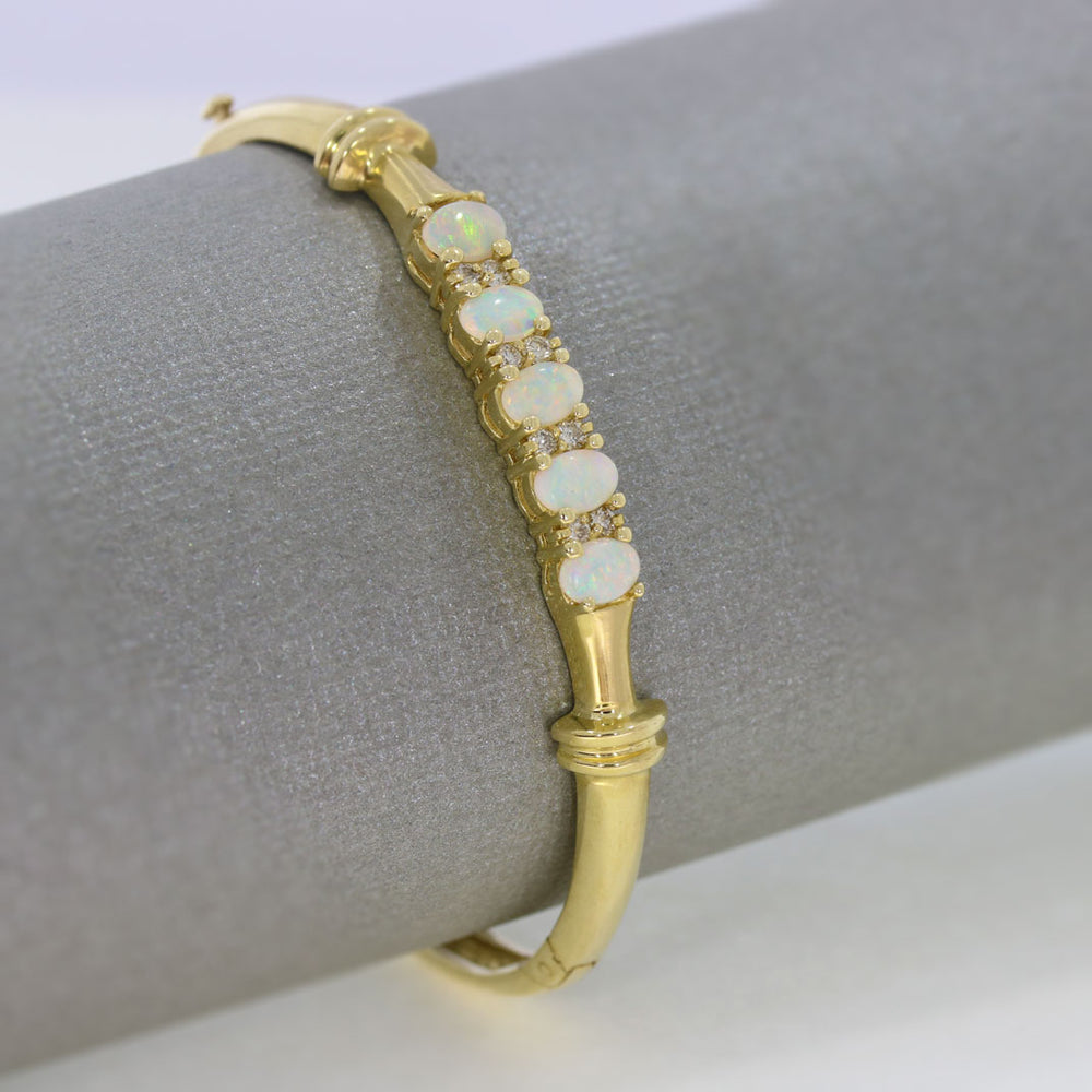 Pre Owned 14ct Yellow Gold Hinged Bangle Set with 5 Oval Opals
