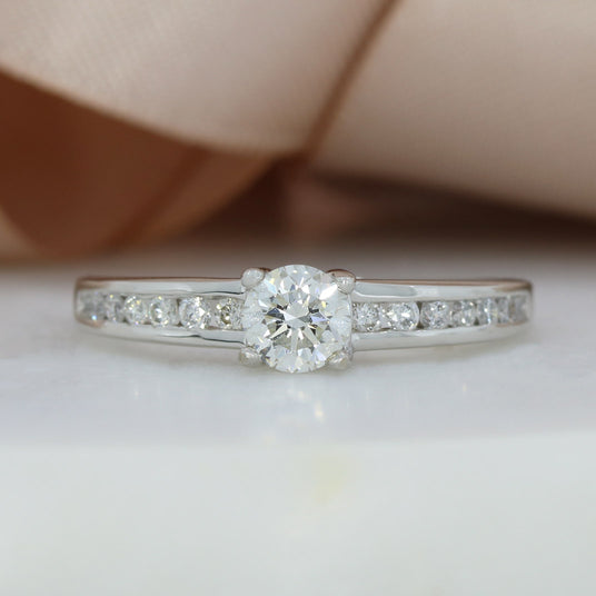 Pre Owned 18ct White Gold Diamond Solitaire Ring with Channel Diamond Shoulders 0.74ct