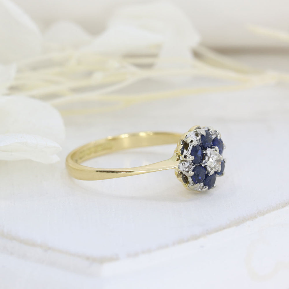 Pre Owned 18ct Yellow Gold Sapphire Cluster Ring with a Diamond Centre