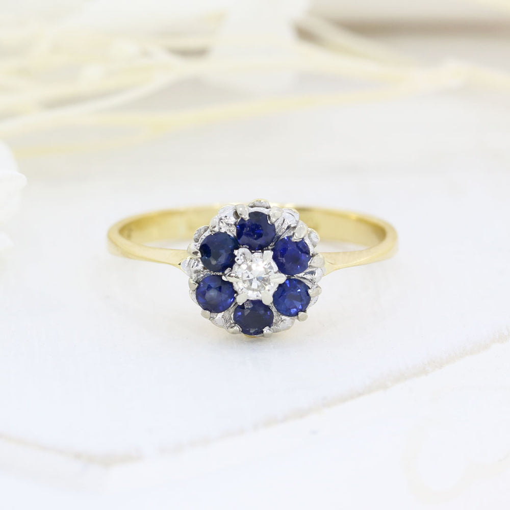 Pre Owned 18ct Yellow Gold Sapphire Cluster Ring with a Diamond Centre