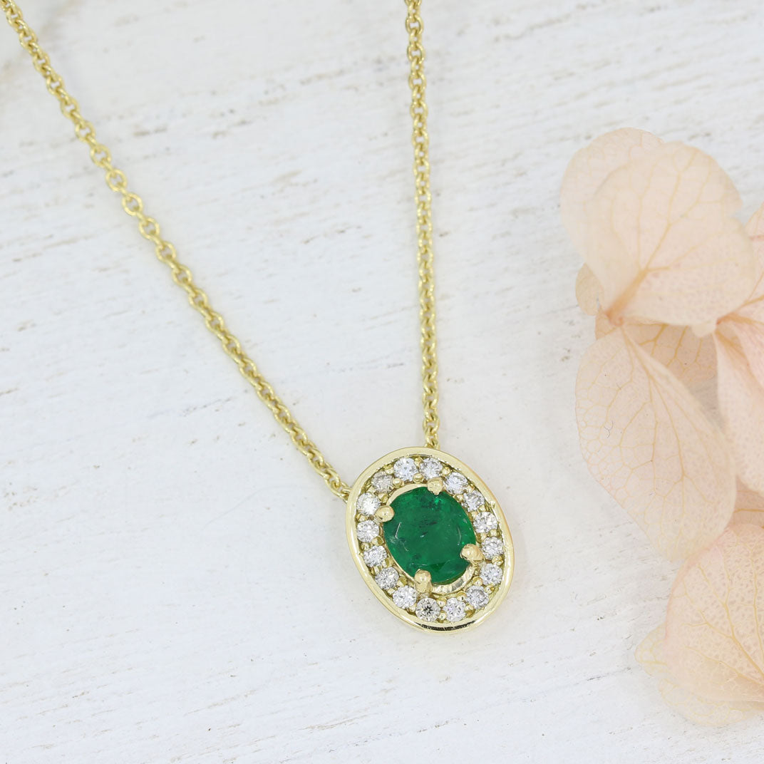 18ct Gold Oval Emerald & Diamond Halo Pendant on a 9ct Yellow Gold Chain