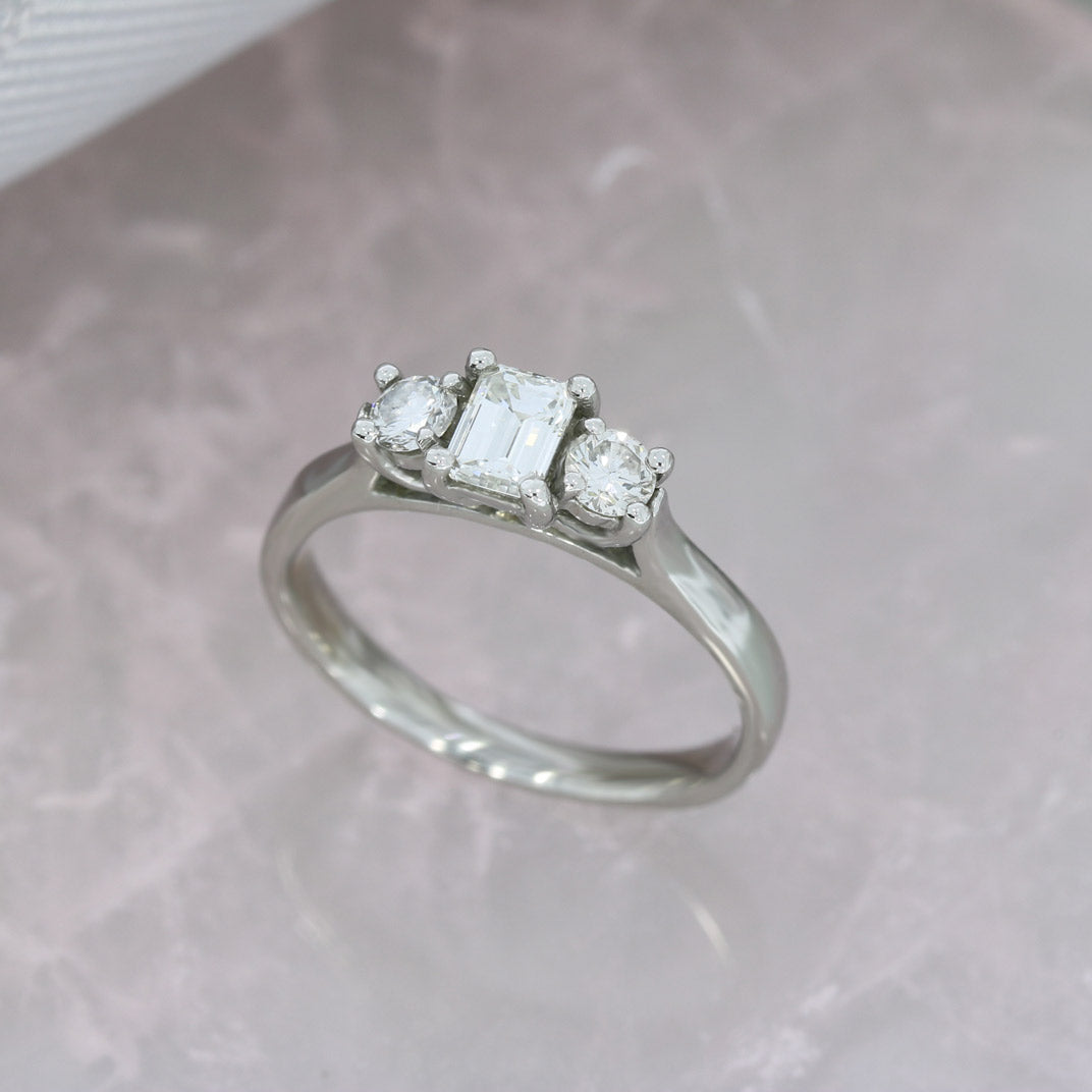 Pre Owned Platinum Emerald & Round Cut 3 Stone Diamond Ring