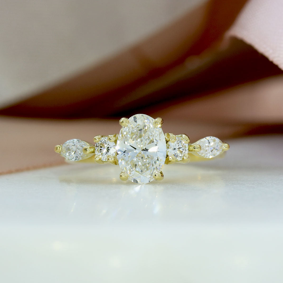 18ct Gold 1ct Oval Lab Grown Diamond Solitaire with Round & Marquise Diamonds on either side
