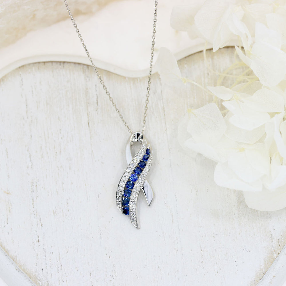 Pre Owned 18ct White Gold Sapphire & Diamond, Ribbon Style Pendant on a 16" chain