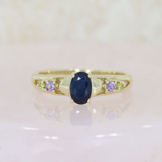 Pre Owned 9ct Yellow Gold Oval Sapphire Ring with Amethyst & Peridot Shoulders