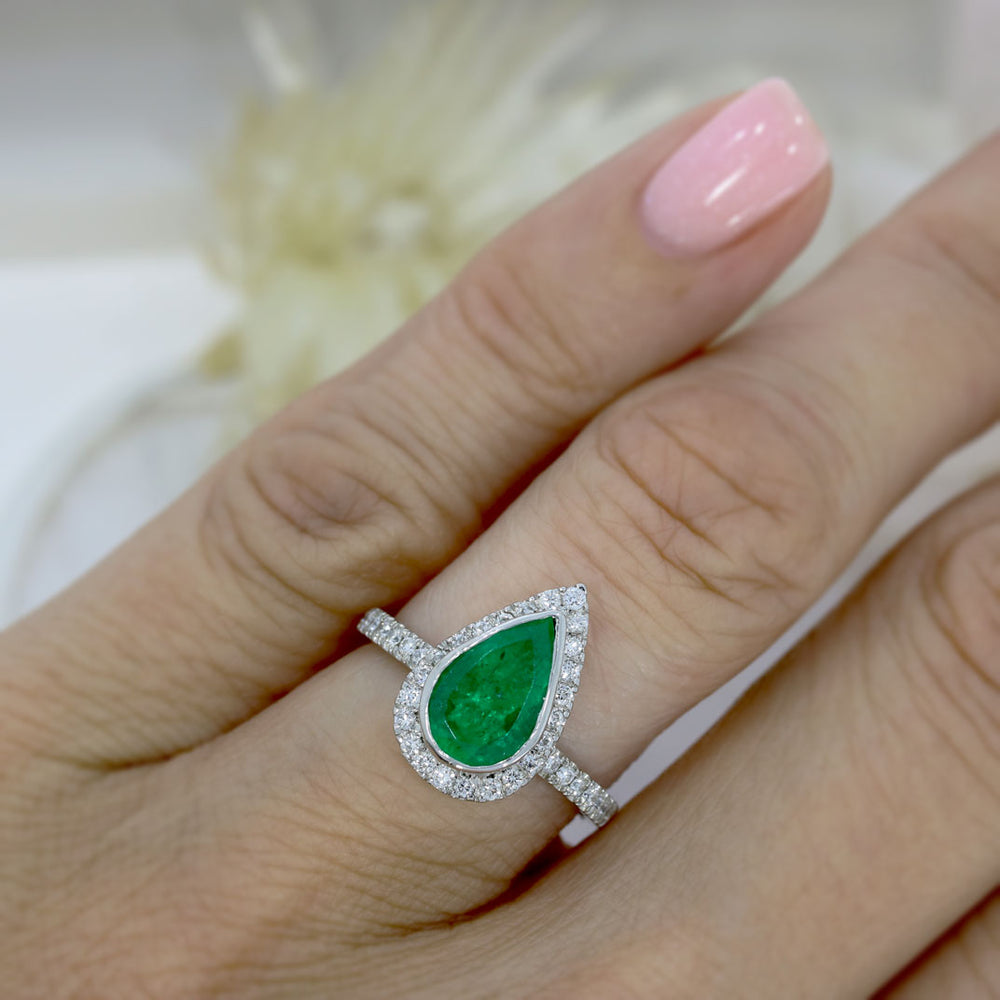 Pre Owned Platinum Pear Shape Emerald & Diamond Halo