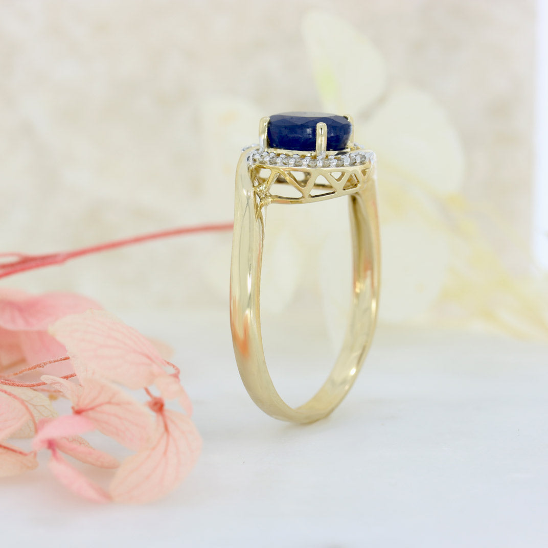 Pre Owned 14ct Gold Oval Sapphire Twist Ring with Diamond Halo
