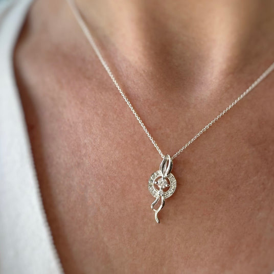 Silver Cubic Zirconia Pave Set Circle with Silver Ribbons