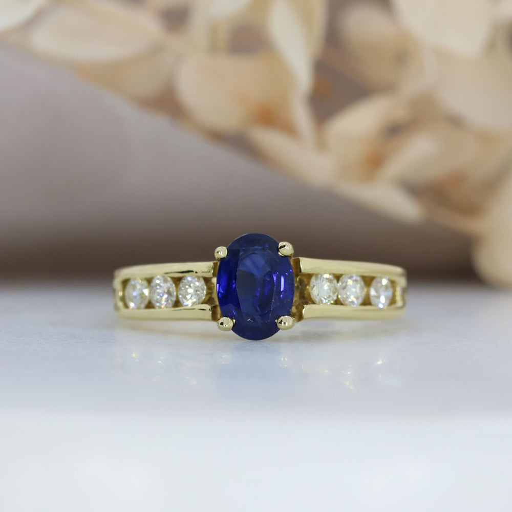 18ct Gold Oval Sapphire Ring with Channel Set Diamond Shoulders