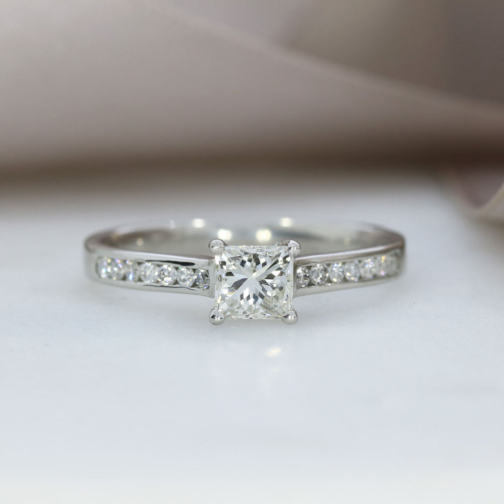 Pre Owned Platinum Princess Cut Solitaire with Channel Set Shoulders 0.75ct
