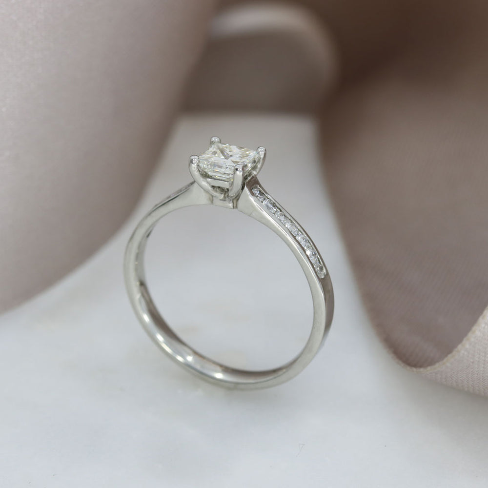 Pre Owned Platinum Princess Cut Solitaire with Channel Set Shoulders 0.75ct