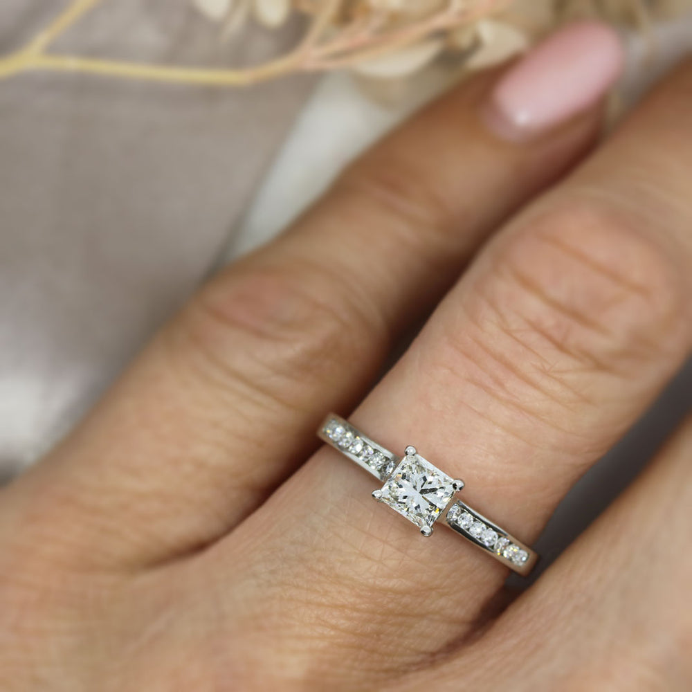 Pre Owned Platinum Princess Cut Solitaire with Channel Set Shoulders 0.75ct