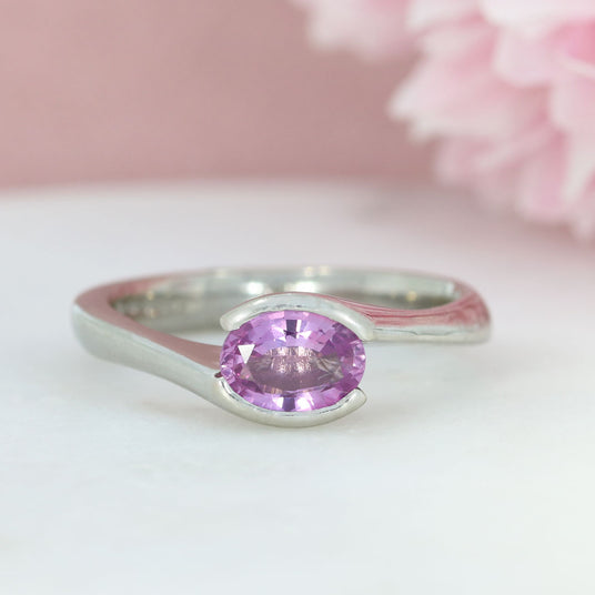 Pre Owned 18ct White Gold Oval Pink Sapphire Cross Over Ring