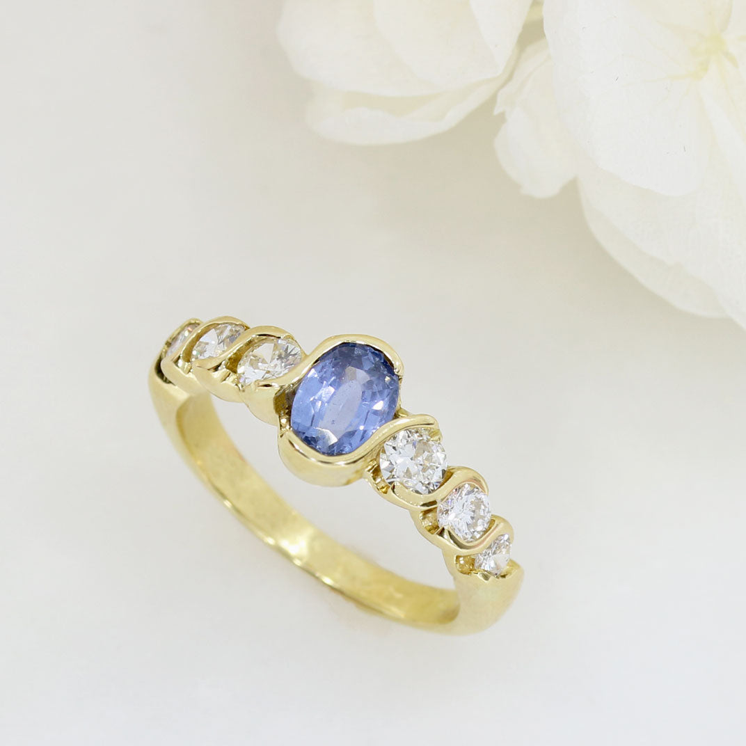18ct Yellow Oval Sapphire Ring With 3 Graduating Diamonds On Each Side