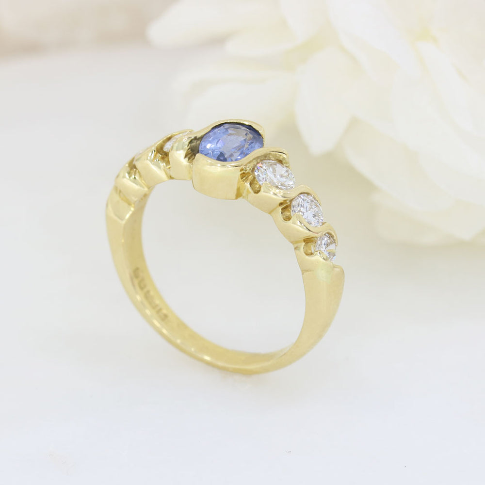 18ct Yellow Oval Sapphire Ring With 3 Graduating Diamonds On Each Side