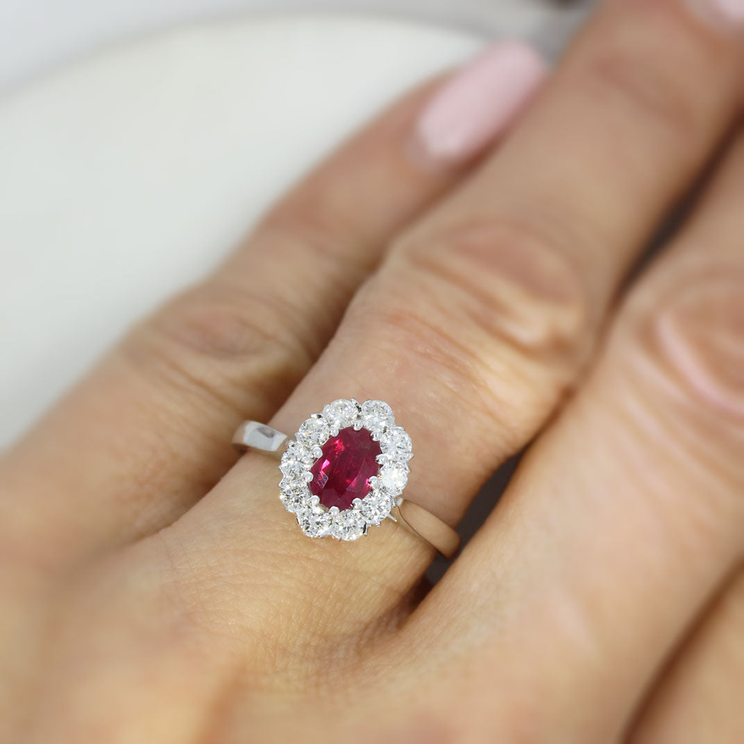 18ct White Gold Claw Set Oval Ruby and Diamond Halo Ring