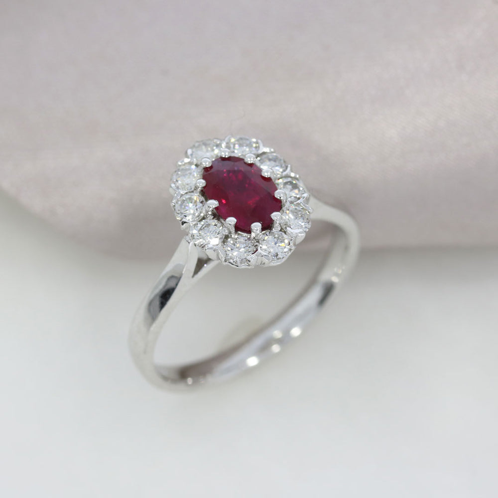 18ct White Gold Claw Set Oval Ruby and Diamond Halo Ring