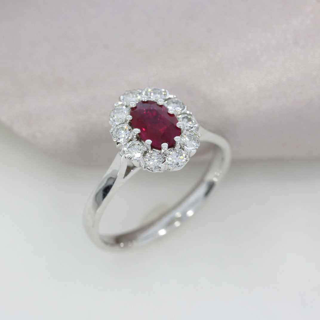 18ct White Gold Claw Set Oval Ruby and Diamond Halo Ring