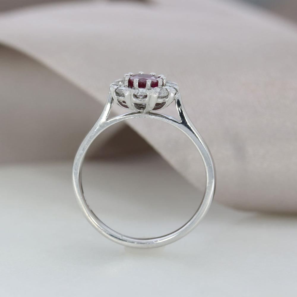 18ct White Gold Claw Set Oval Ruby and Diamond Halo Ring