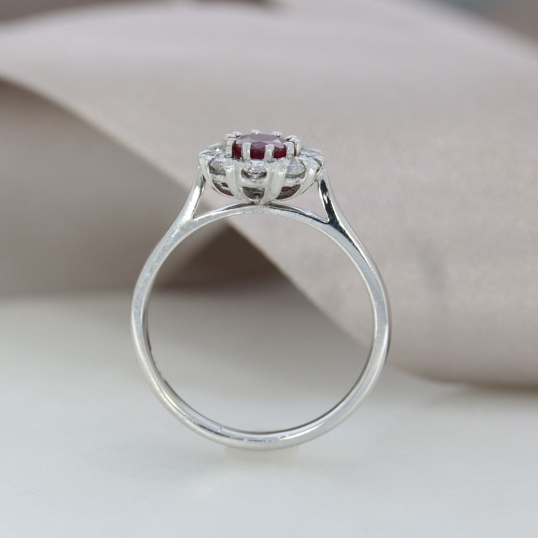 18ct White Gold Claw Set Oval Ruby and Diamond Halo Ring