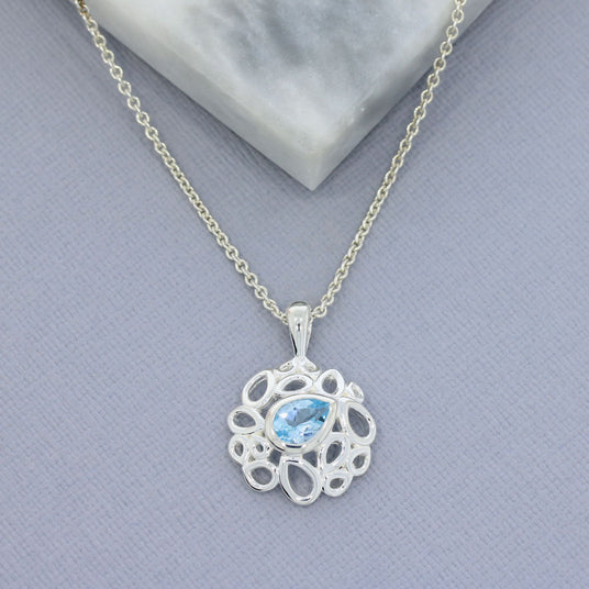 Silver Fancy Pendant With Pear Shape Blue Topaz & Chain