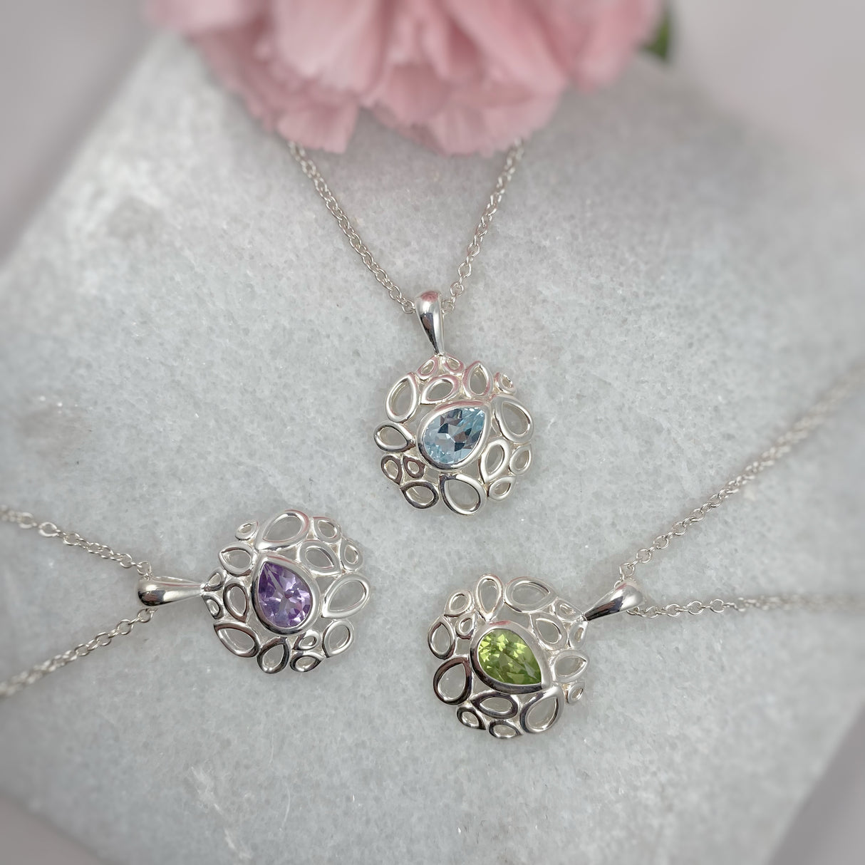 Silver Fancy Pendant With Pear Shape Blue Topaz & Chain