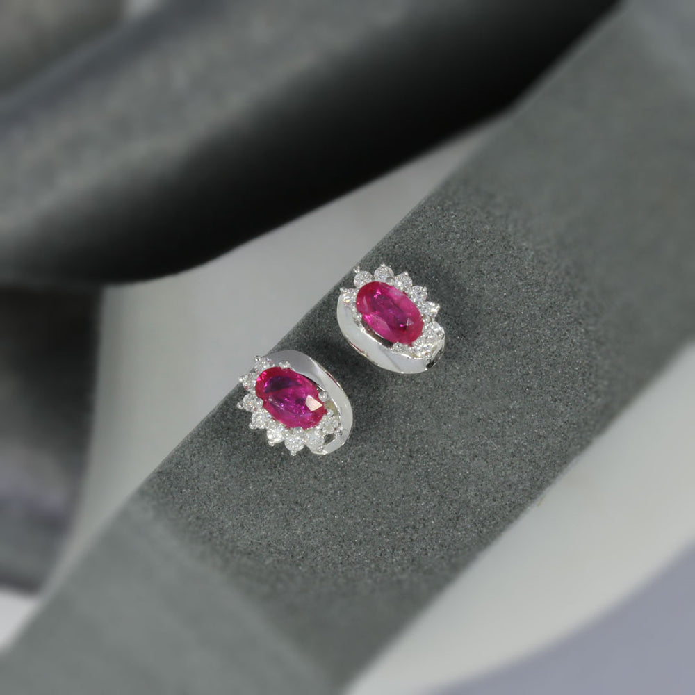 9ct White Gold Oval Ruby Earrings With Claw Set Diamonds
